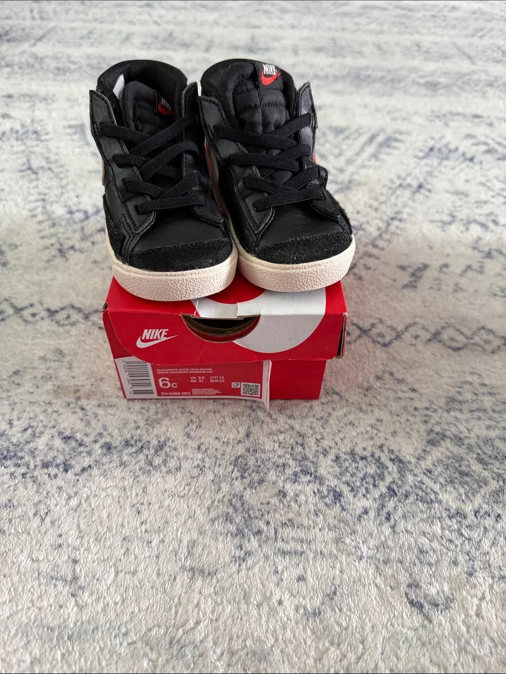 Nike Kids Black High-Top Sneakers with Red Logo